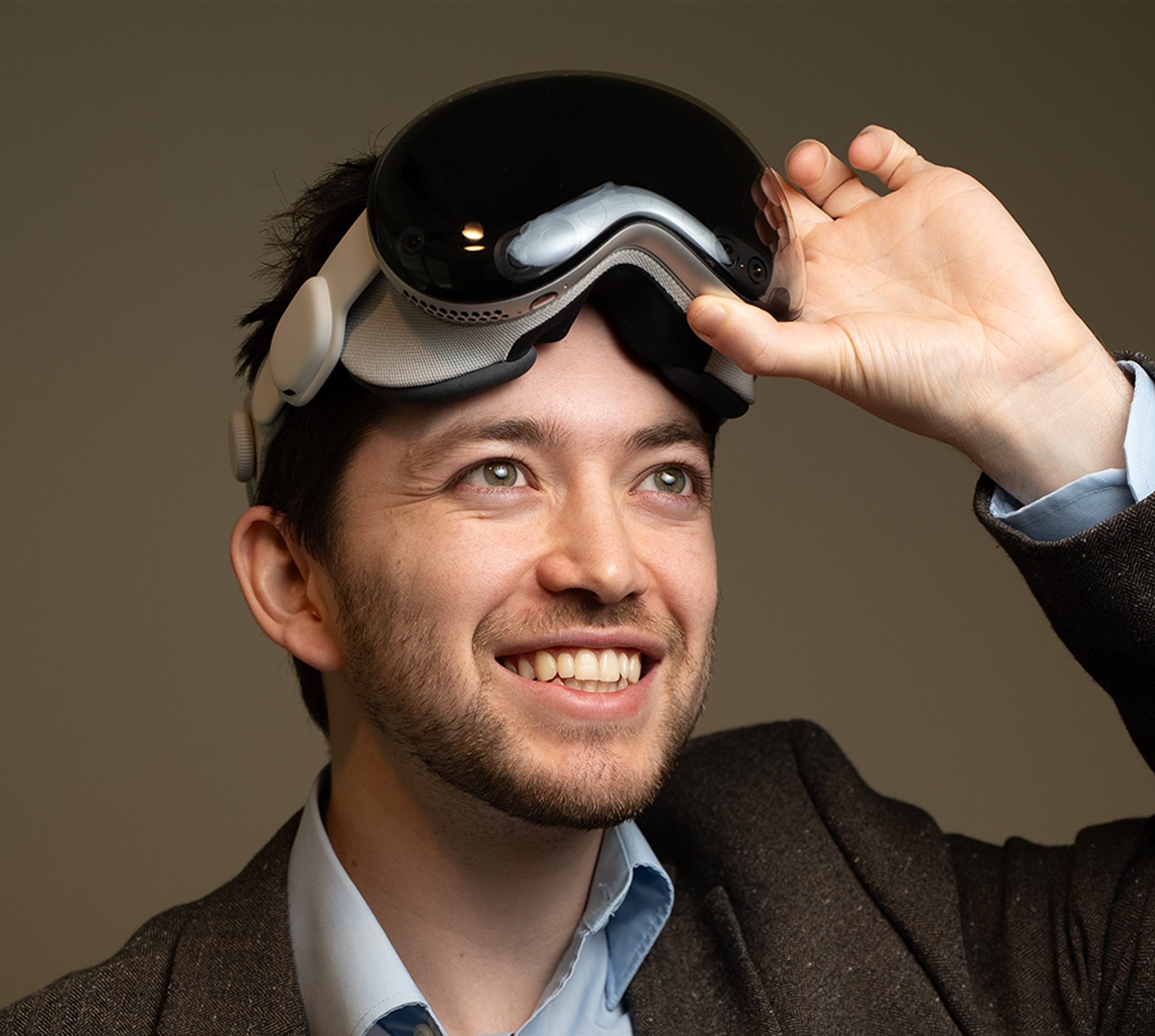 Degly Pava lifting an XR headset