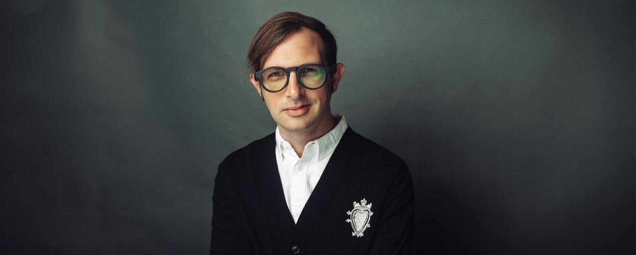Portrait of Kris Pilcher wearing glasses